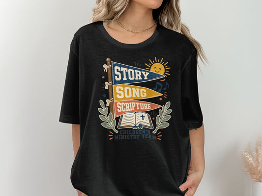 Black t-shirt with graphic of flags saying "Story," "Song," "Scripture," sun, music notes, book, and cross.