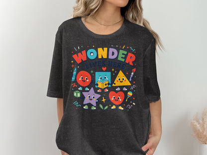 T-shirt with "Wonder Lives Here" and cartoon shapes.