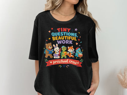 Black t-shirt with "Tiny Questions, Beautiful Work" and "preschool crew" text.