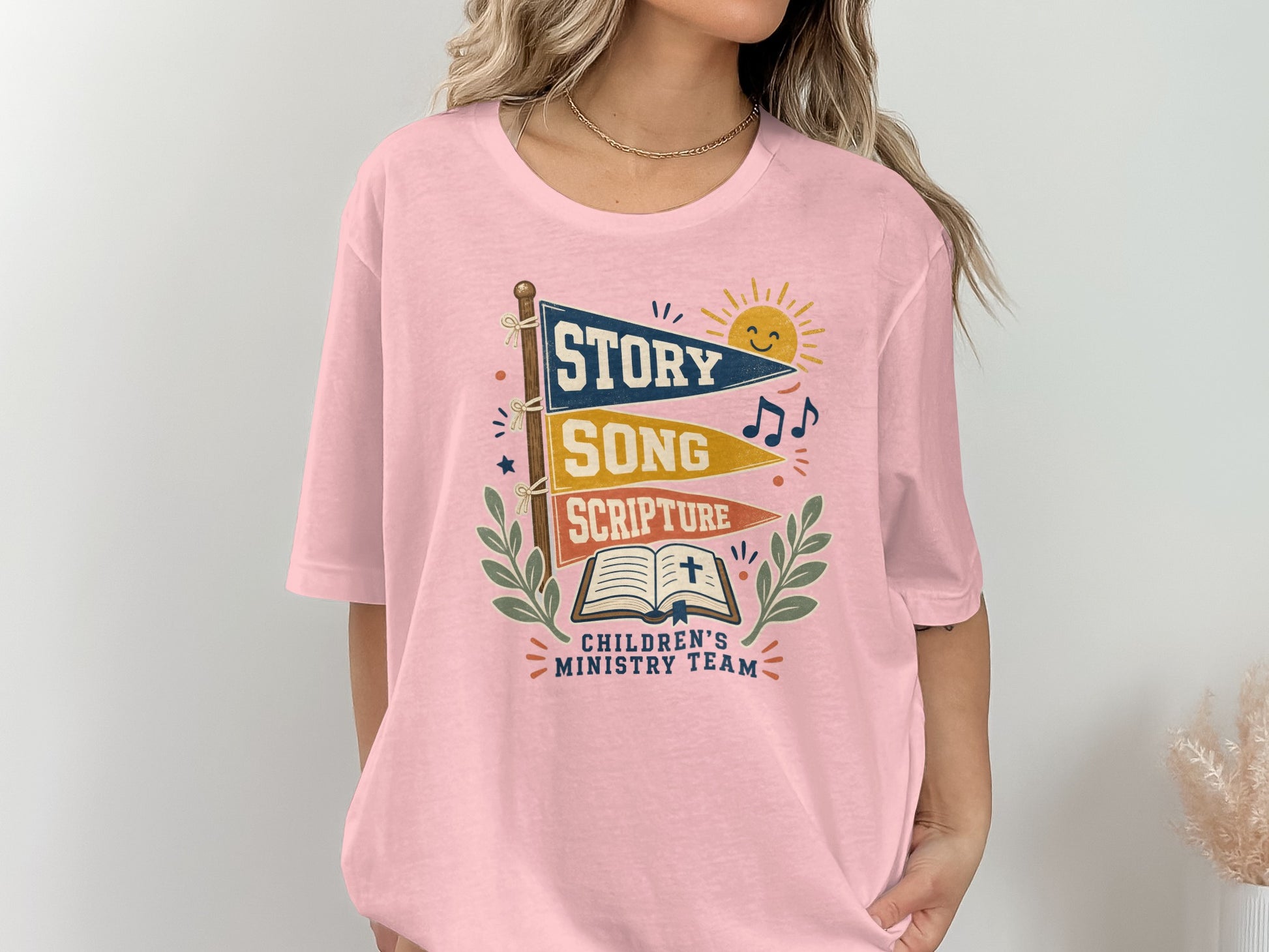 Children's Ministry Team t-shirt with Story, Song, Scripture flags and open Bible.