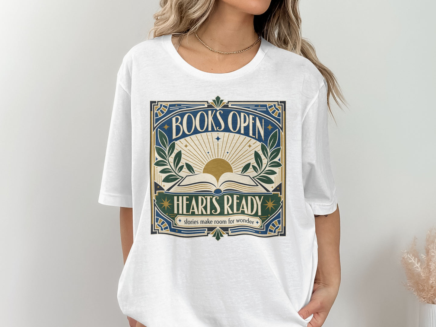 White t-shirt with "Books Open Hearts Ready" graphic.