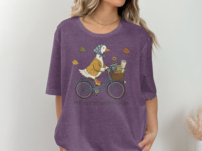 Duck in a sweater and scarf riding a bicycle with books in the basket.