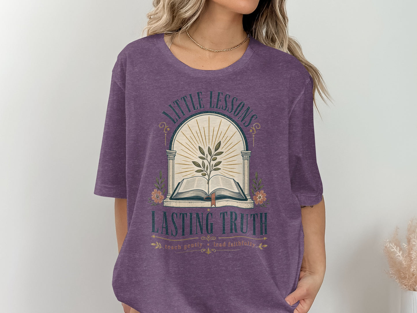 Purple t-shirt with "Little Lessons Lasting Truth" and open book graphic.