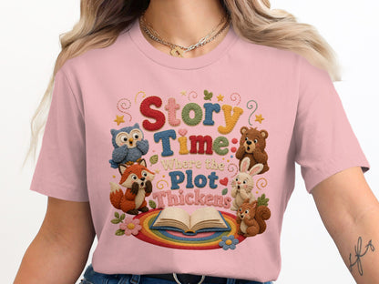 Pink t-shirt with "Story Time Where the Plot Thickens" text and woodland animals.