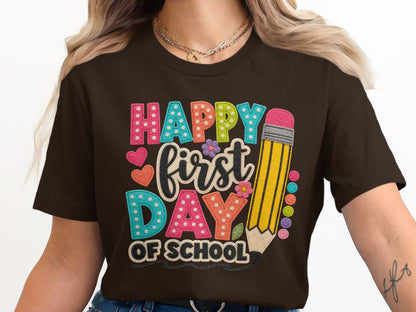 Happy first day of school text with pencil and colorful polka dot letters.