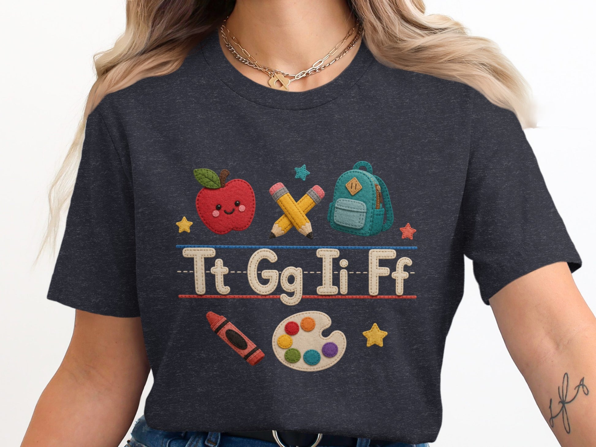 T-shirt with apple, backpack, pencils, and letters Tt Gg Ii Ff.