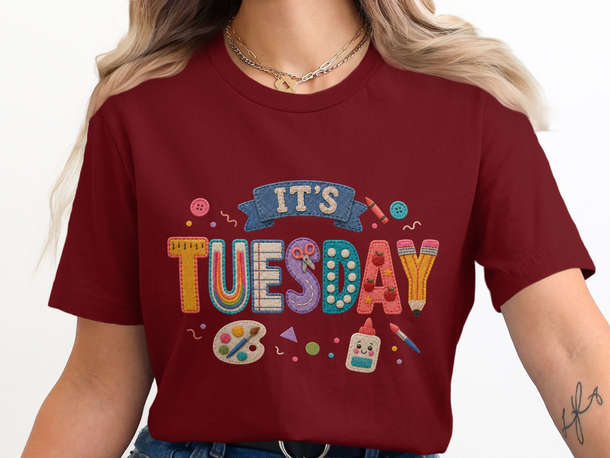 Maroon t-shirt with "IT'S TUESDAY" text and school supplies graphics.