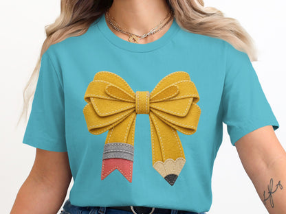 Teal t-shirt with yellow pencil bow graphic.