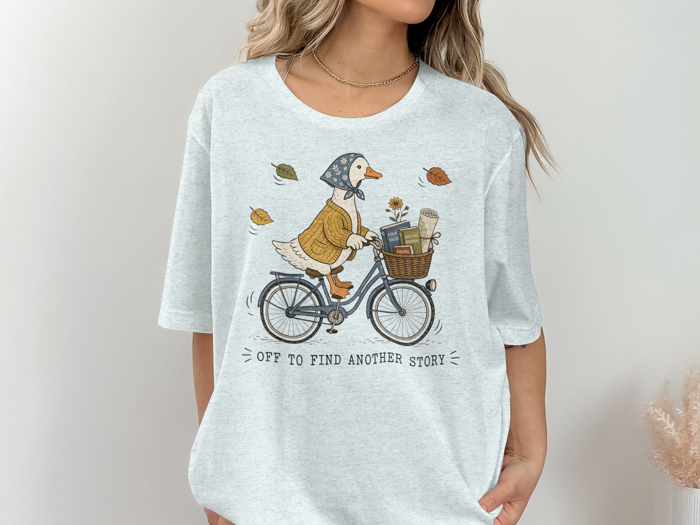 Illustration of a goose on a bicycle with books and flowers in the basket.