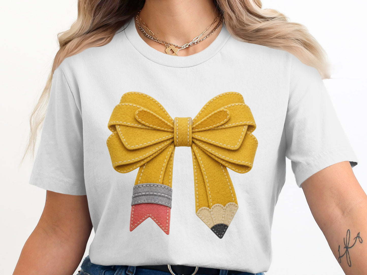 Yellow pencil bow graphic on a white t-shirt