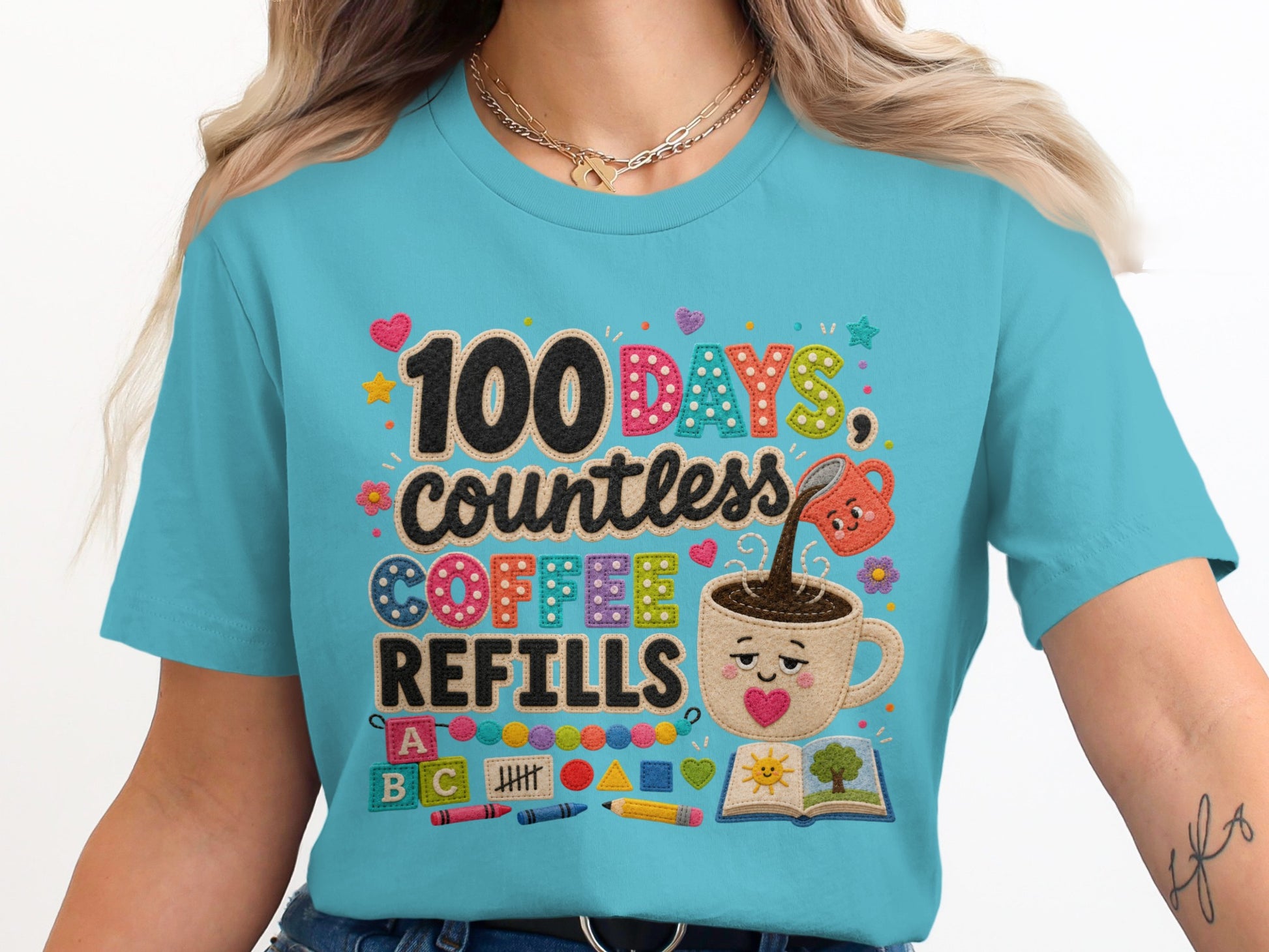 Turquoise shirt with "100 DAYS, countless COFFEE REFILLS" and school icons.