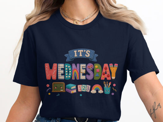 Navy t-shirt with "It's Wednesday" in colorful, cartoon-style letters.