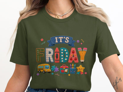 Olive green t-shirt with "IT'S FRIDAY" and school-themed appliques.