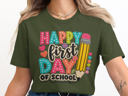 Green t-shirt with "Happy first DAY OF SCHOOL" text and a large pencil.
