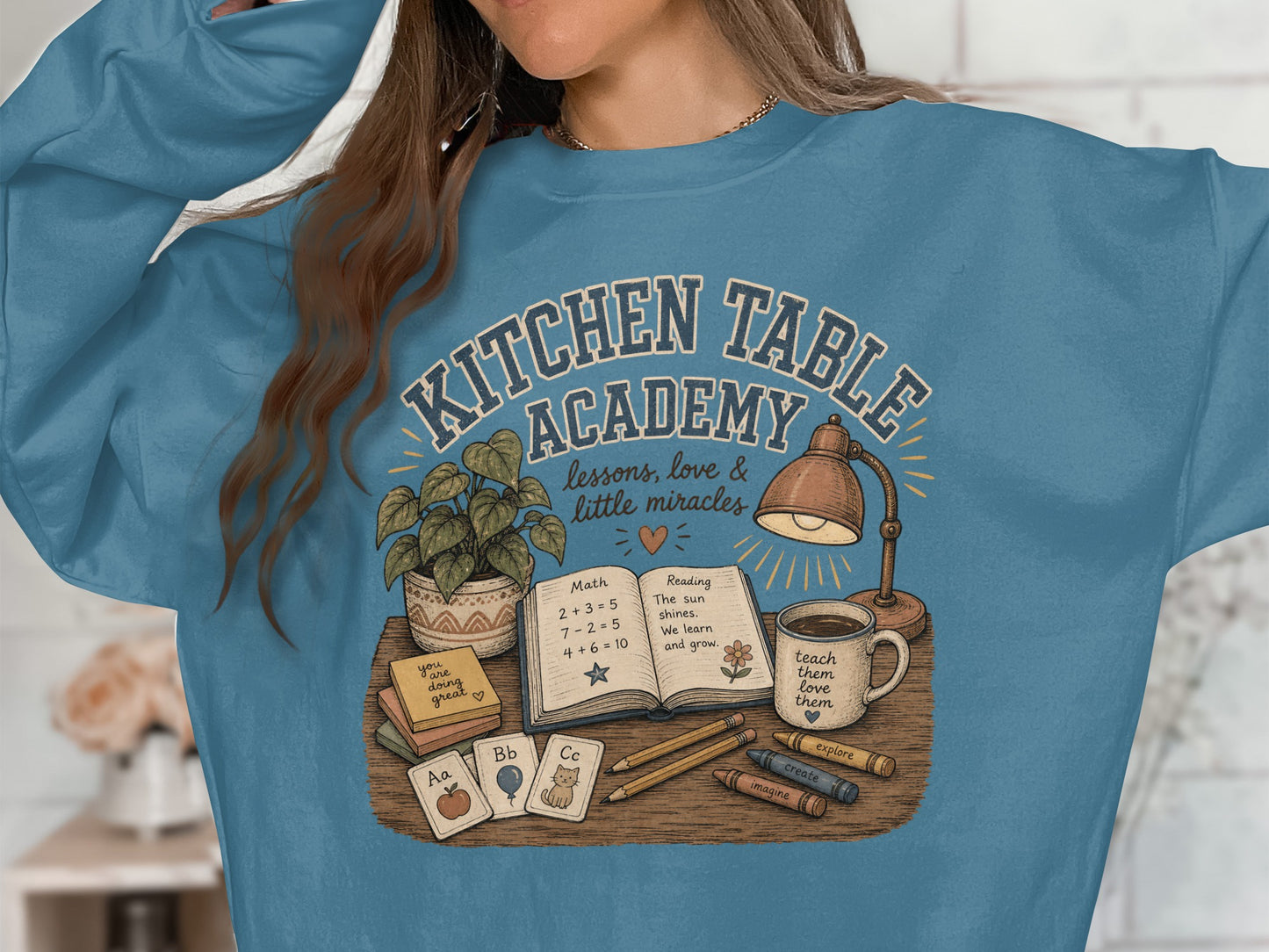 Kitchen Table Academy graphic with books, lamp, coffee, and school supplies.