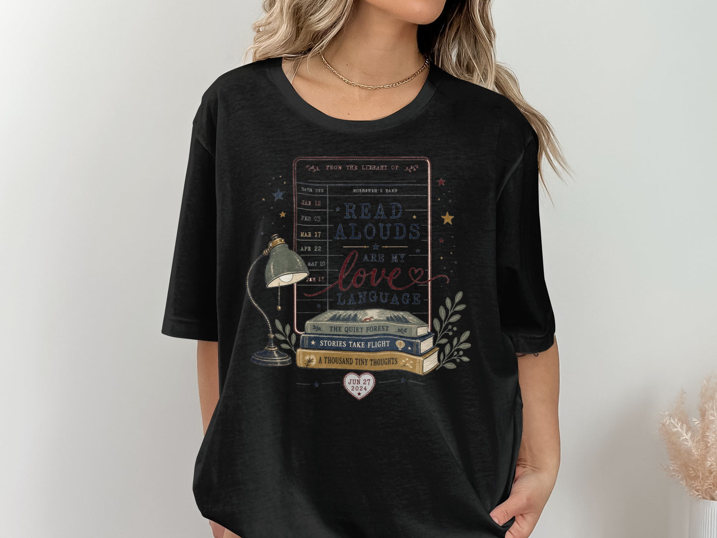Black t-shirt graphic with stacked books, lamp, and text "Read Alouds Are My Love Language."