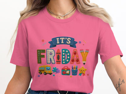 Pink t-shirt with "IT'S FRIDAY" text and school-themed embroidered icons.