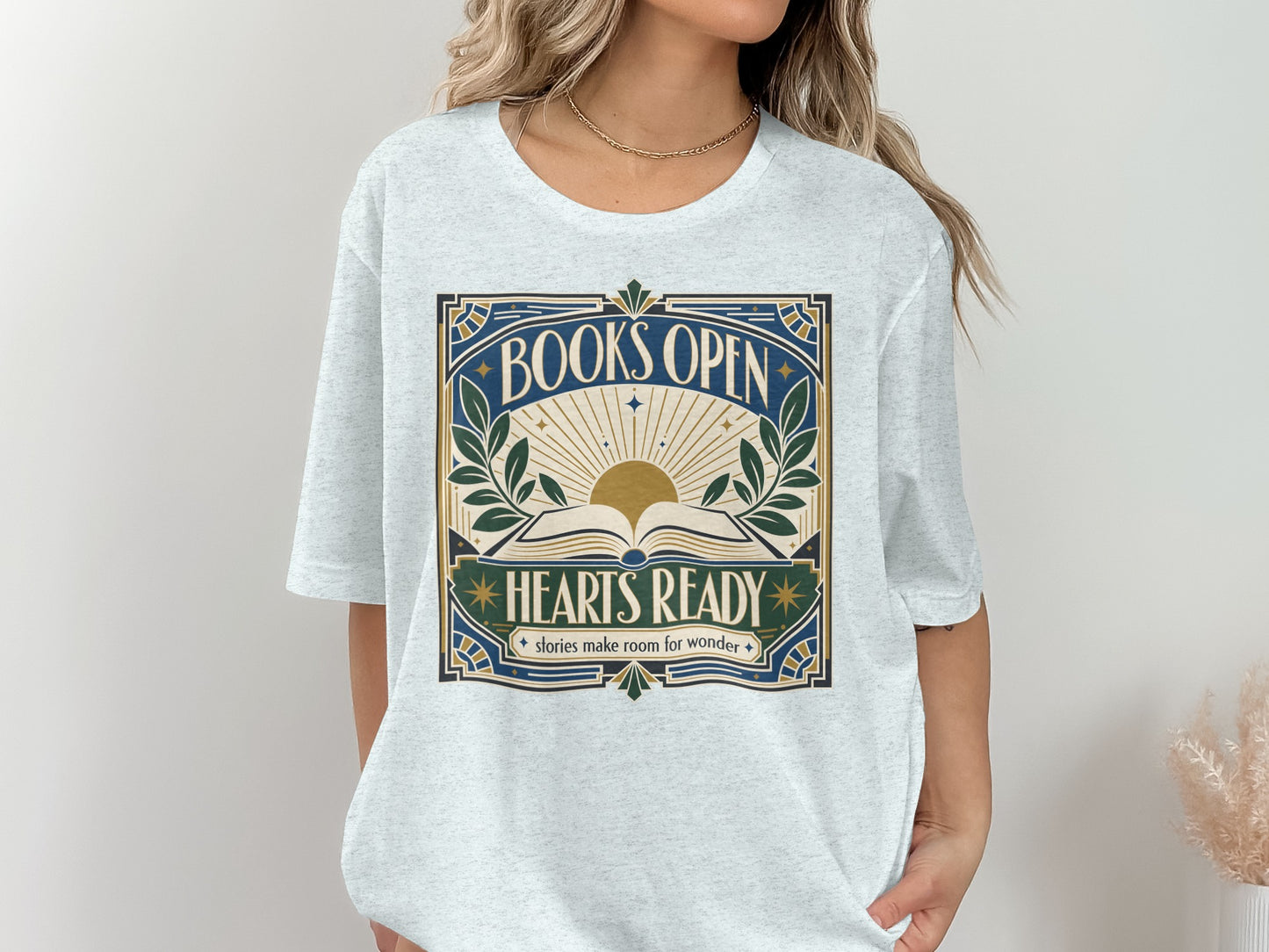Gray t-shirt with "BOOKS OPEN HEARTS READY stories make room for wonder" text and an open book graphic.