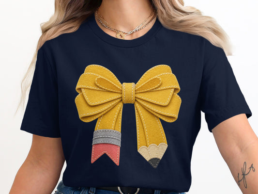 Navy t-shirt with a yellow pencil bow graphic and two gold necklaces