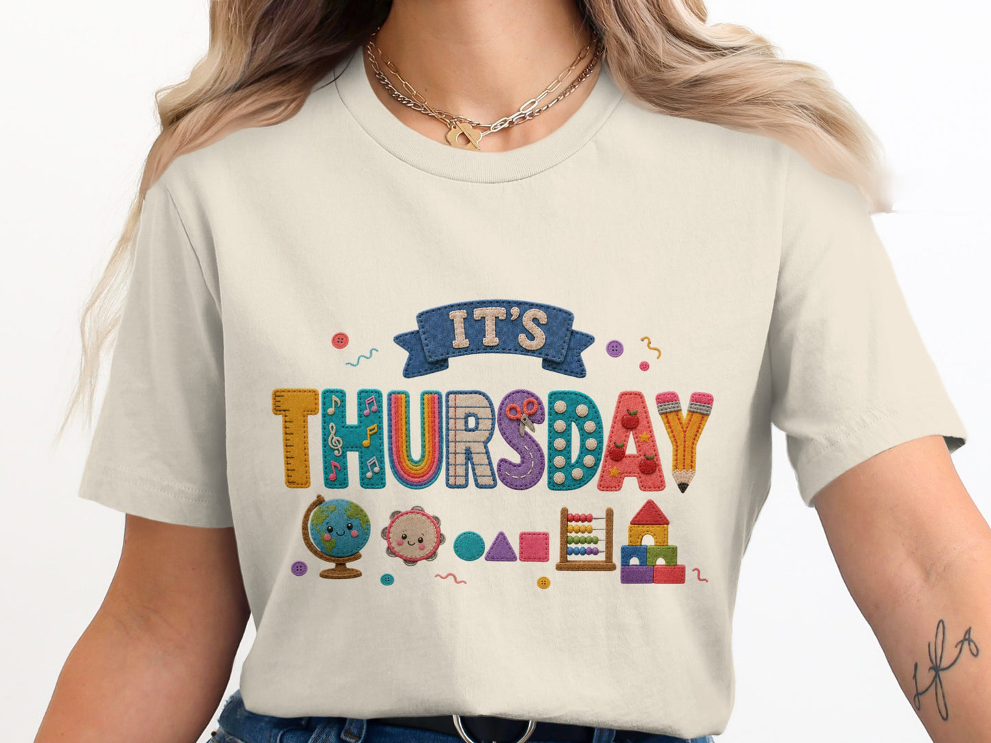 Cream t-shirt with "IT'S THURSDAY" text and educational icons.