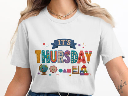 "IT'S THURSDAY" text with school-themed graphics on a white t-shirt.