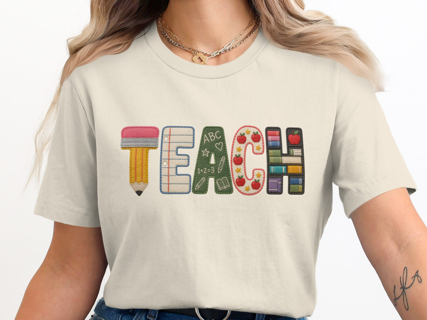 Embroidered "TEACH" with school-themed letters including a pencil and books.