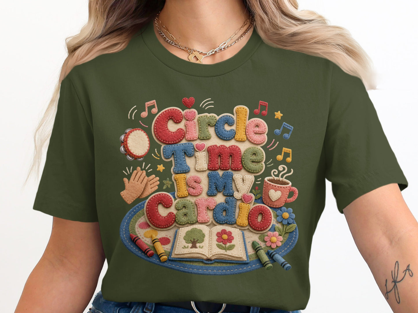 Green t-shirt with textured text "Circle Time Is My Cardio" and school-themed graphics.