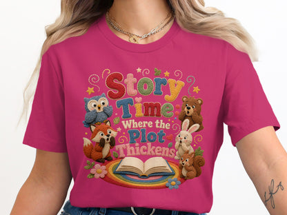 Pink t-shirt with embroidered "Story Time Where the Plot Thickens" and woodland creatures.