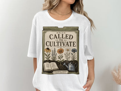 White t-shirt with "Called to Cultivate" design featuring flowers, book, and watering can.