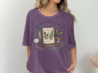 T-shirt graphic with vintage field notes, butterfly, mushroom, and text.