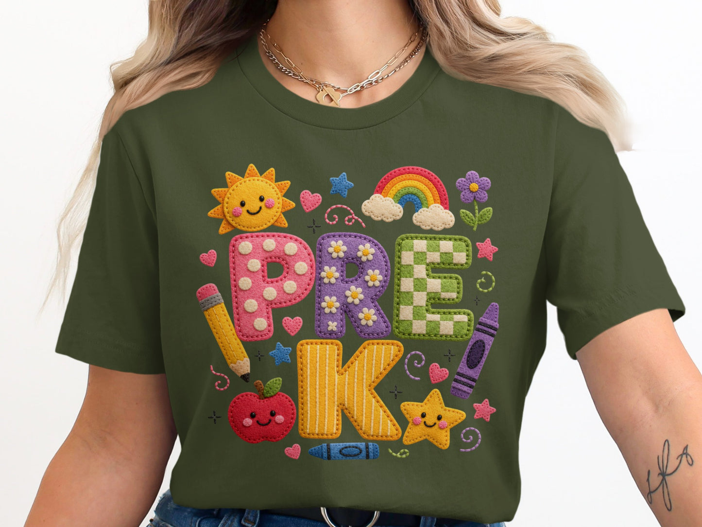 Green t-shirt with "PRE K" in appliqué letters surrounded by school-themed graphics.