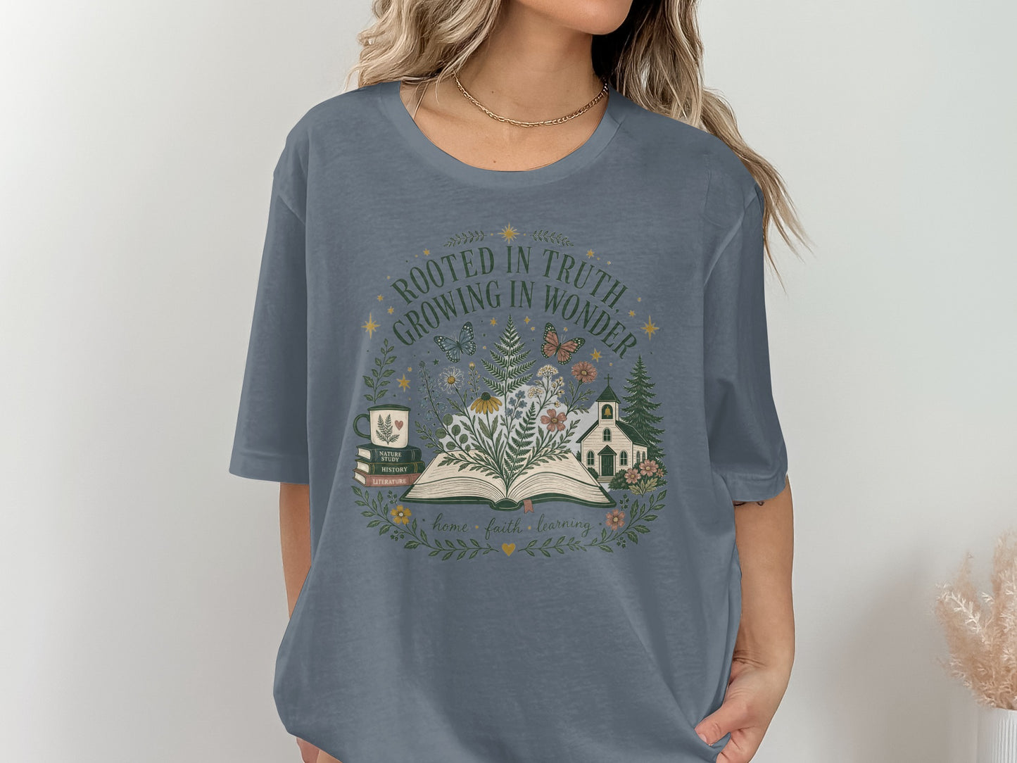 T-shirt with "Rooted in Truth, Growing in Wonder" text and nature-themed graphic.