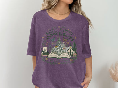 Purple t-shirt with "Rooted in Truth, Growing in Wonder" text and nature illustration.