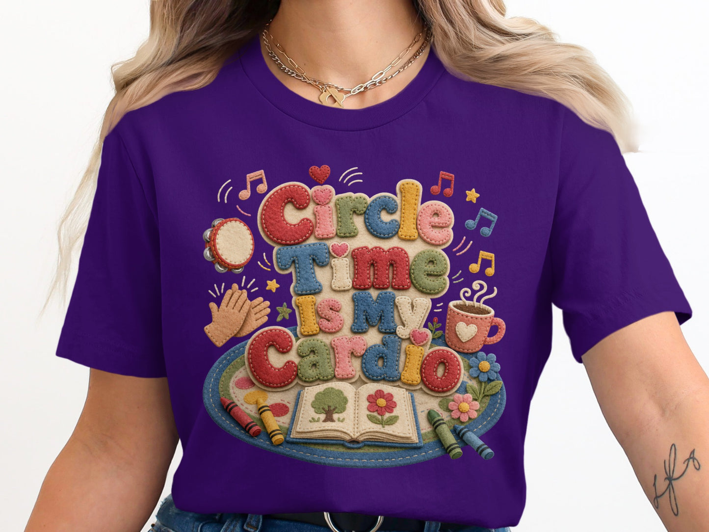 Purple t-shirt with "Circle Time Is My Cardio" felt-like text and playful illustrations.