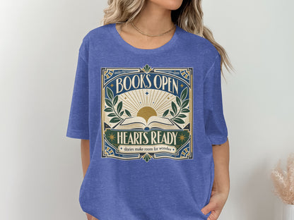 Blue t-shirt with "BOOKS OPEN HEARTS READY stories make room for wonder" graphic.