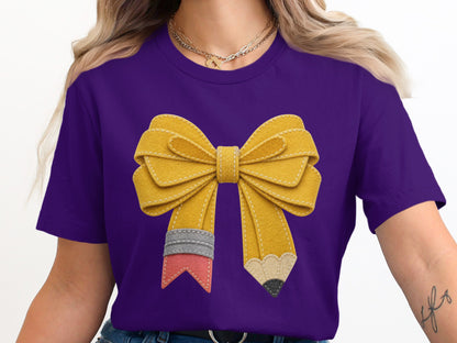 Purple t-shirt with yellow pencil-shaped bow graphic.