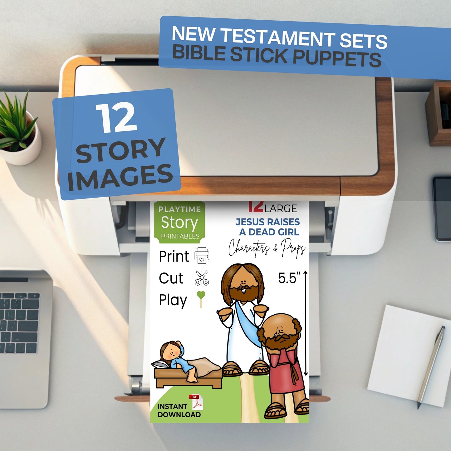 Bible stick puppets packaging with printer and laptop on a desk