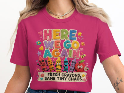 T-shirt with "Here We Go Again Fresh Crayons. Same Tiny Chaos." and cartoon crayons.