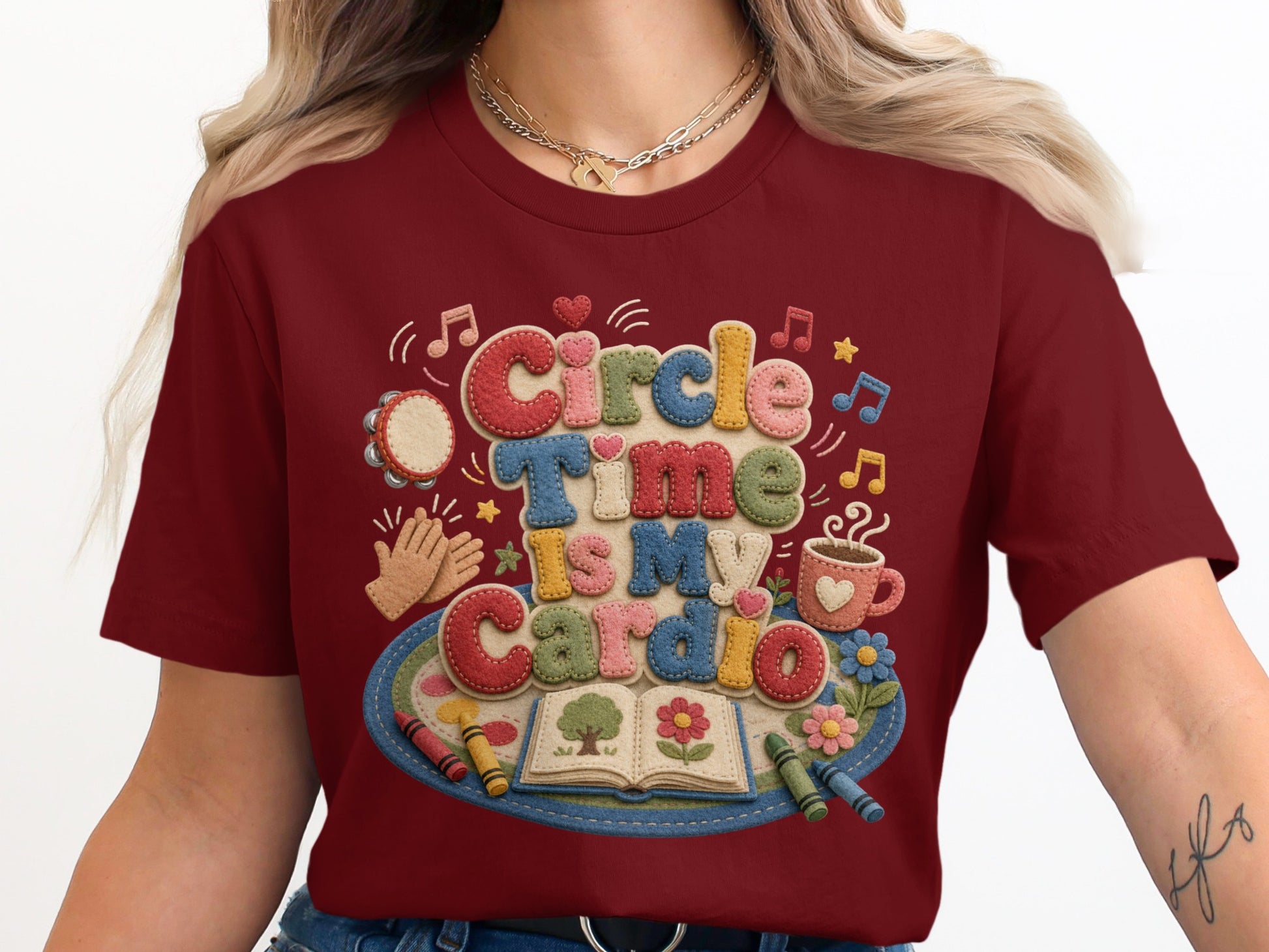 Maroon t-shirt with "Circle Time Is My Cardio" text and artsy elements.