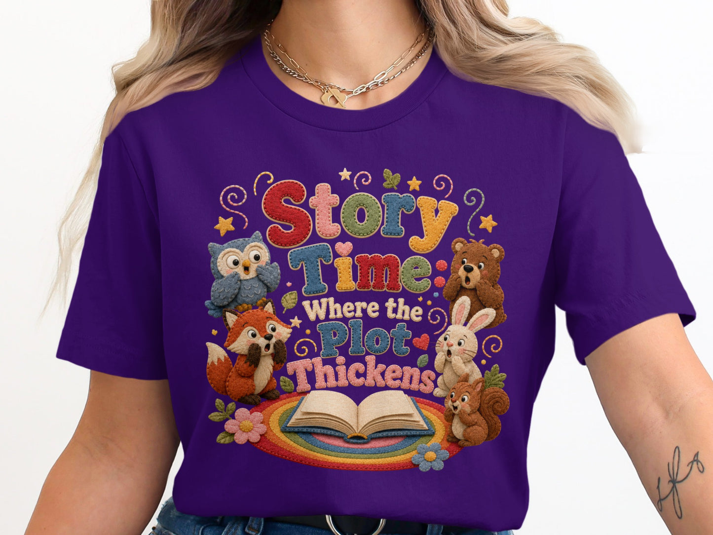 Purple t-shirt with "Story Time Where the Plot Thickens" text and storybook animal characters.