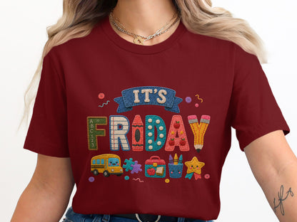 Maroon t-shirt with embroidered "IT'S FRIDAY" text and school-themed icons.