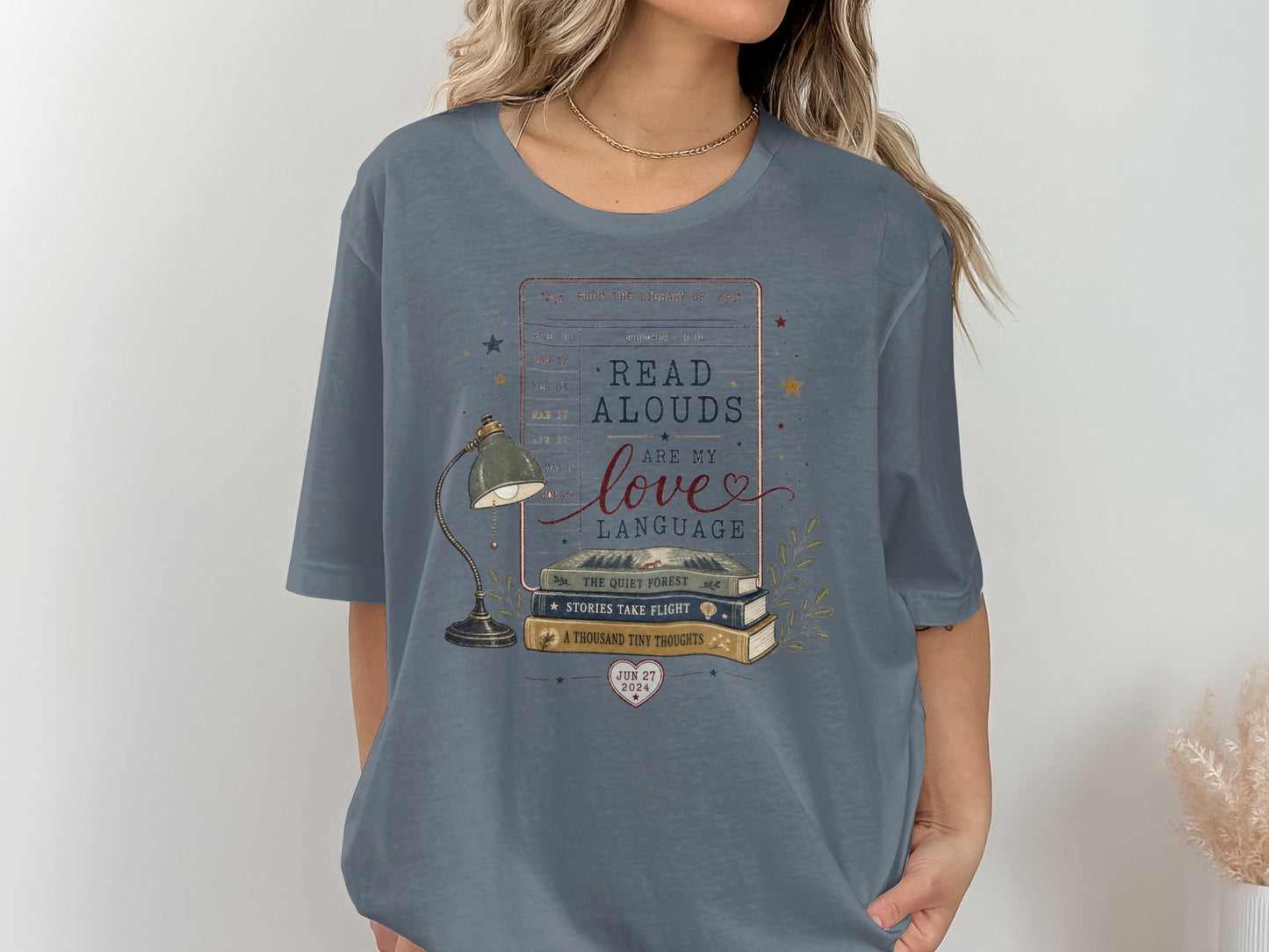 T-shirt graphic with stacked books, a lamp, and the text "Read Alouds Are My Love Language."