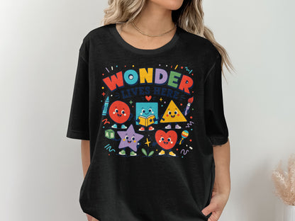 Black t-shirt with colorful cartoon shapes and text "WONDER LIVES HERE"