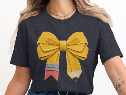 Yellow bow design with pencil tips on a dark gray t-shirt.