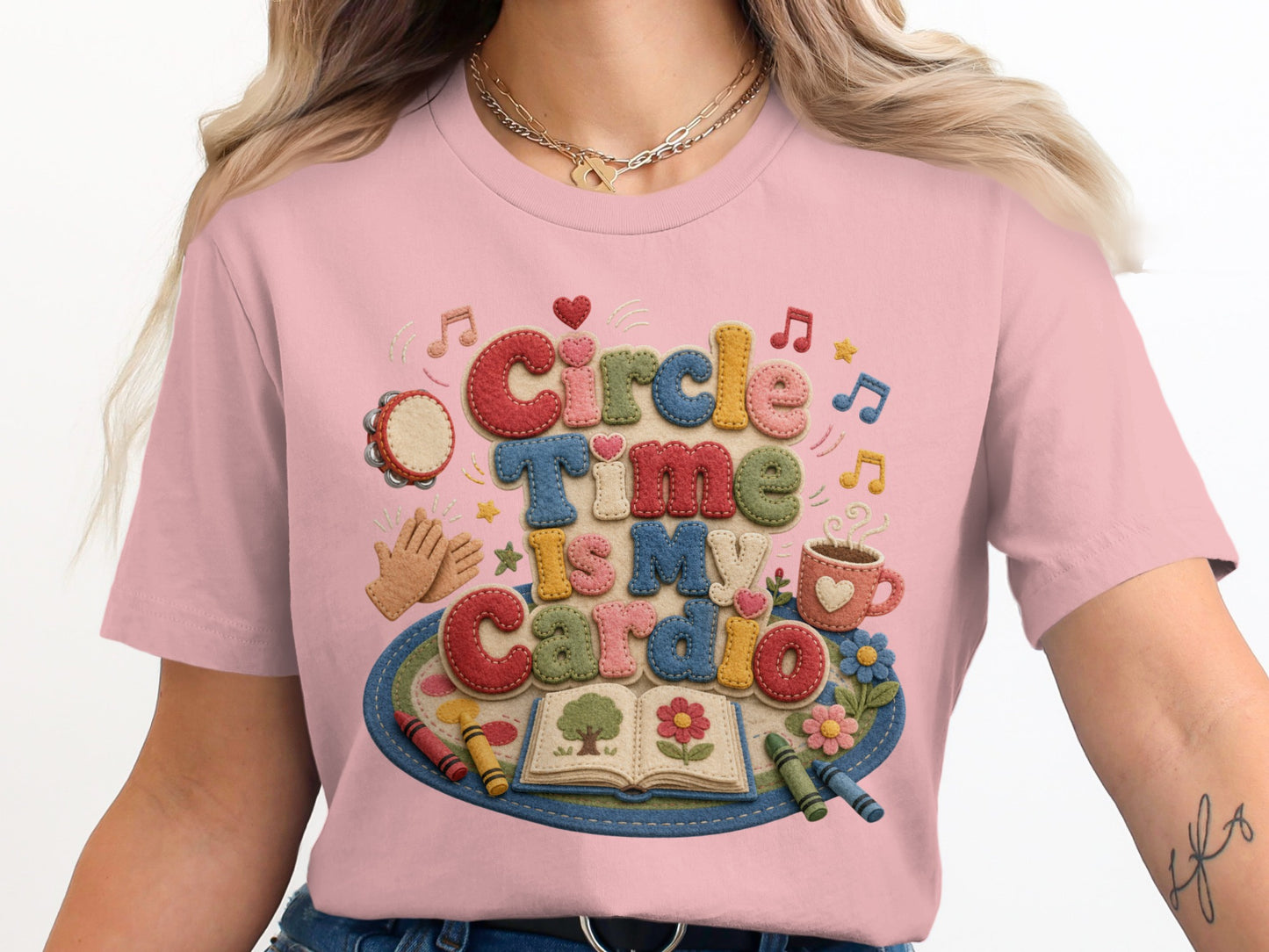Pink t-shirt with "Circle Time Is My Cardio" text and school supplies graphics.