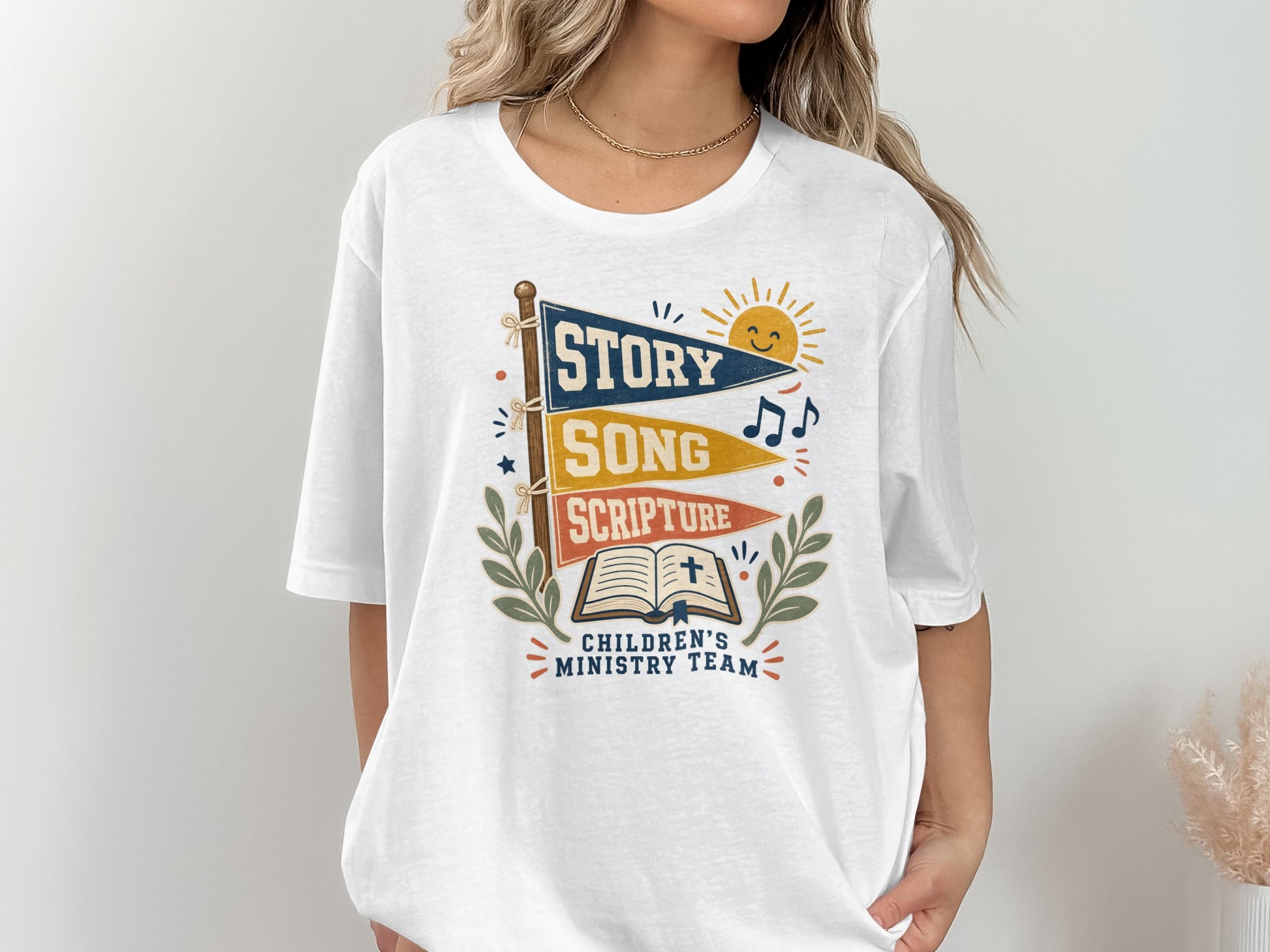 White t-shirt with "Story, Song, Scripture" flags and "Children's Ministry Team" text.