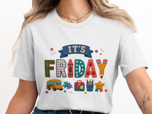 White t-shirt with "It's Friday" text and school-themed icons.
