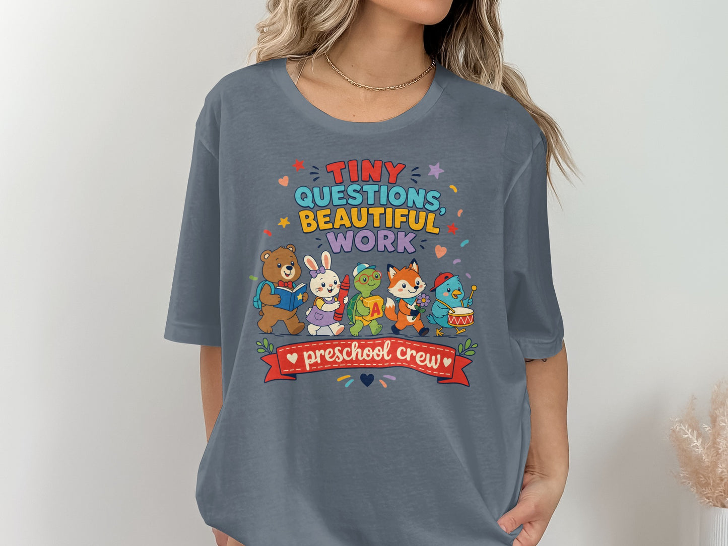 T-shirt with "Tiny Questions, Beautiful Work, Preschool Crew" and cartoon animals