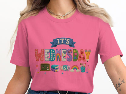 Embroidery design on a pink t-shirt saying "IT'S WEDNESDAY".