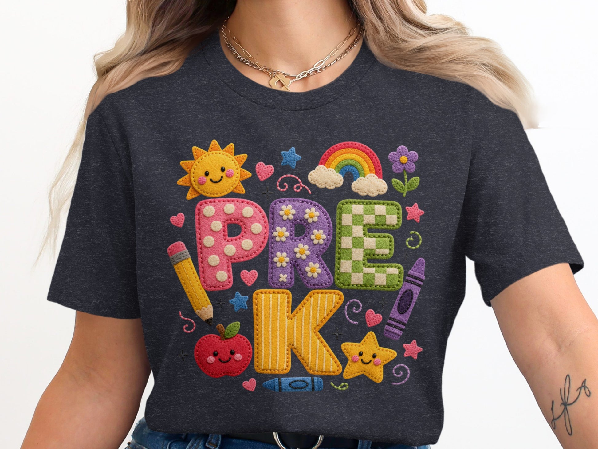 T-shirt with "PRE K" text and school supplies in a colorful, embroidered style.